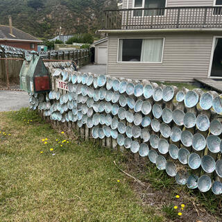 Pāua shells cover the fences of house number 1072.