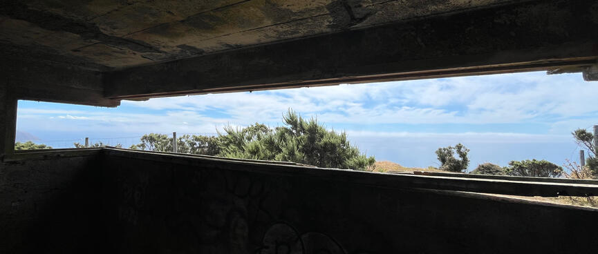 The view out to the ocean through the narrow slit in the concrete bunker wall.