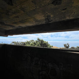 The view out to the ocean through the narrow slit in the concrete bunker wall.