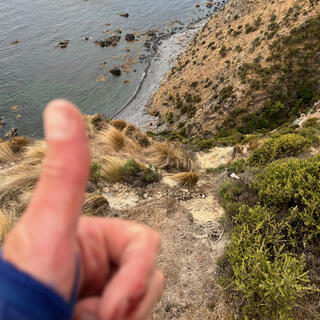 Giving a thumbs-up at the top of a hill.