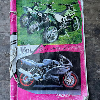 Photos of dirt and road bikes on the cover of ʼVol 2 Cave Hutʼ. 