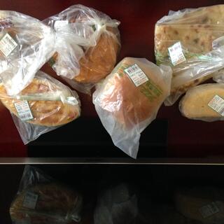 Six plastic bags containing baked goods.