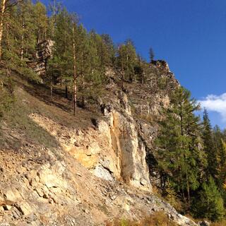 A rocky hill erodes in a landslide.