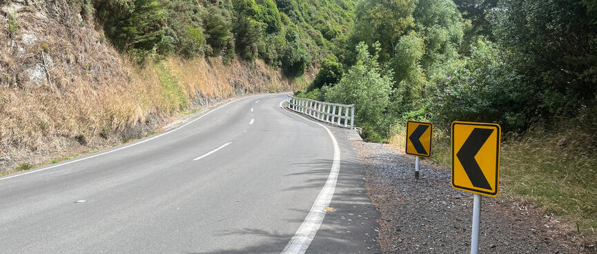 The road disappears around a blind right hand corner.