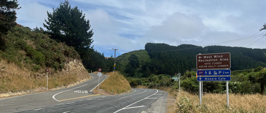 A sign marks the turnoff to West Wind Recreation Area, where one can walk, sight-see, mountain-bike and park.