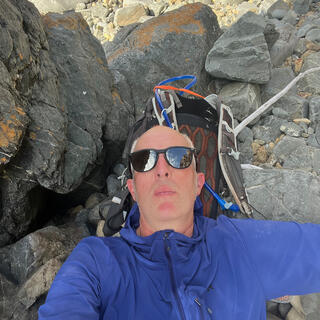 Lying down on rocks, using my pack for a pillow.