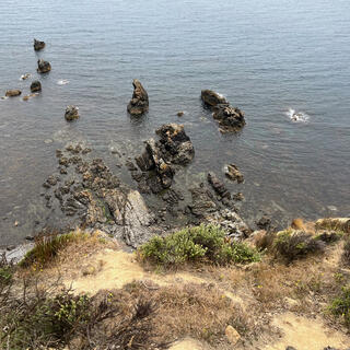 Looking down the steep hillside which appears to drop away.