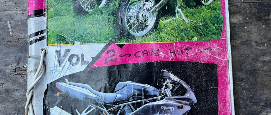 Photos of dirt and road bikes on the cover of ʼVol 2 Cave Hutʼ. 
