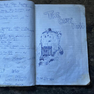 A pen drawing  by Joel Denison aged 12, depicting the wooden frontage of the cave and its deck.