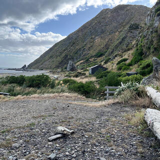 Steep hills and shingle beaches.