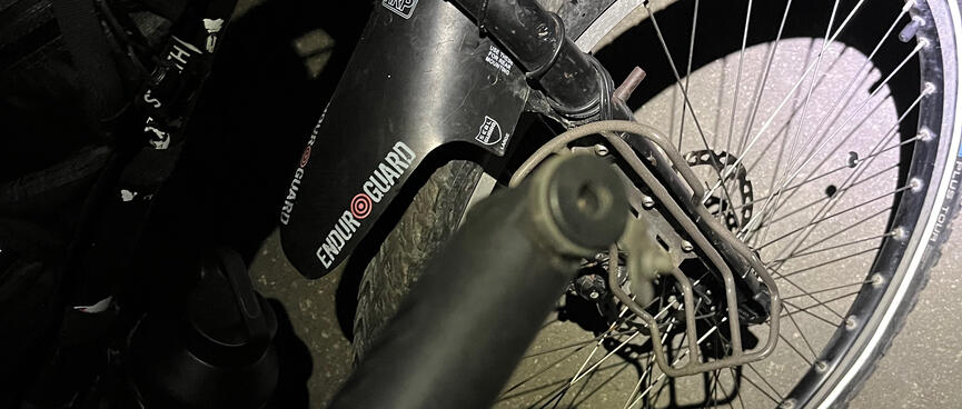 A hand pump and a bicycle wheel.