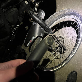 A hand pump and a bicycle wheel.