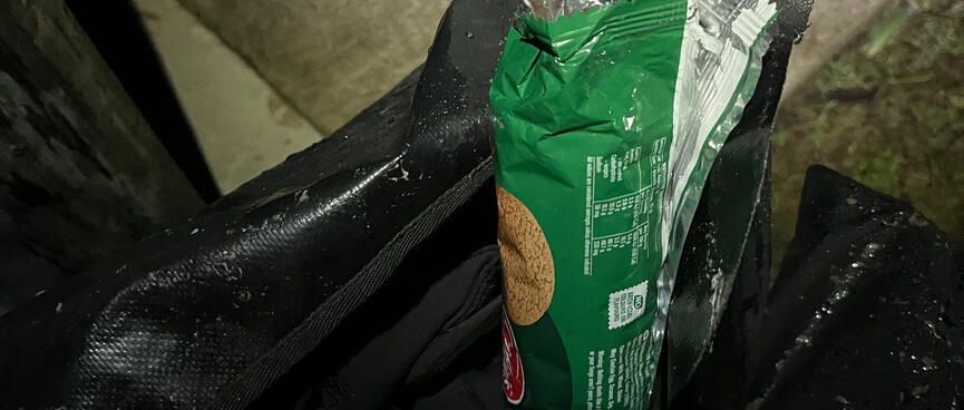 An open pack of Gingernuts in a pannier bag.