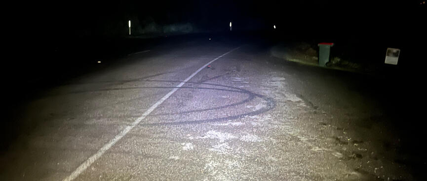 Circular tyre marks on the road.