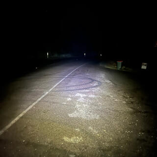 Circular tyre marks on the road.