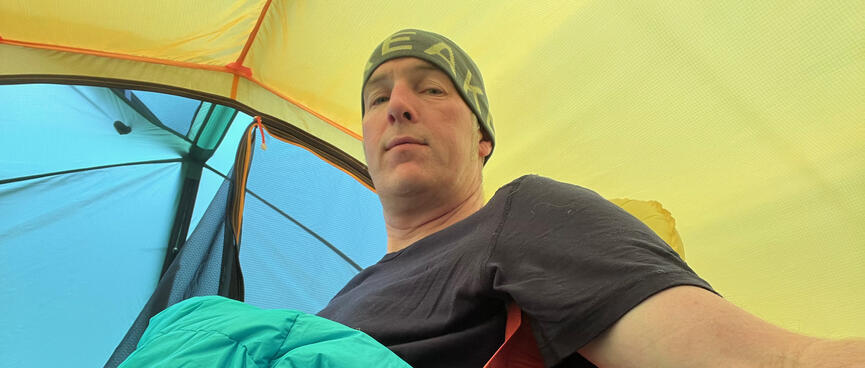 Lounging in my sleeping mat chair inside my new tent.