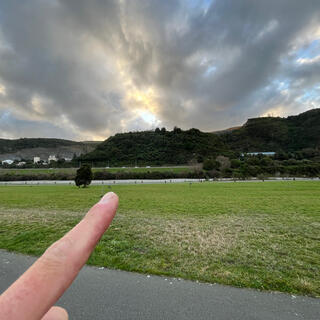 A scrubby hill next to a quarry.