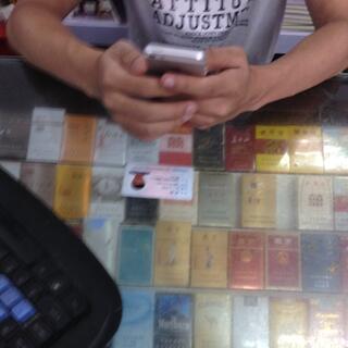 A Chinese ID and many cigarette packets.