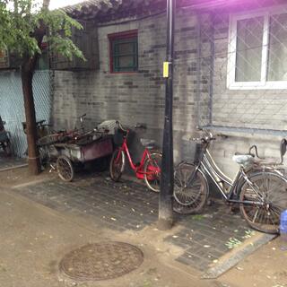 Ladies bicycles and a cart with bicycle wheels.