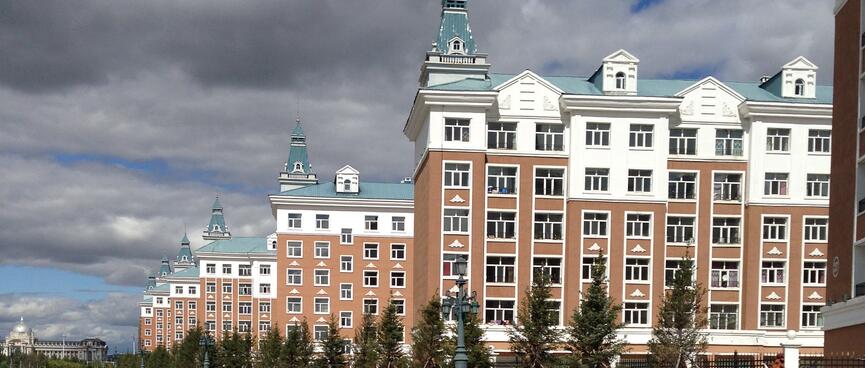 A block of stately and near identical buildings.