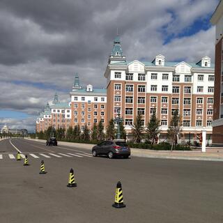 A block of stately and near identical buildings.