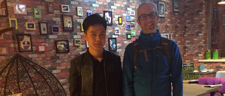A young man clad all in black is also a developer.