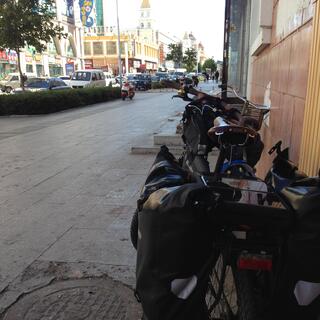 Pannier bags and a solar panel grace the rear of my touring bike.