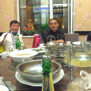 The thirteen of us seated around the table.