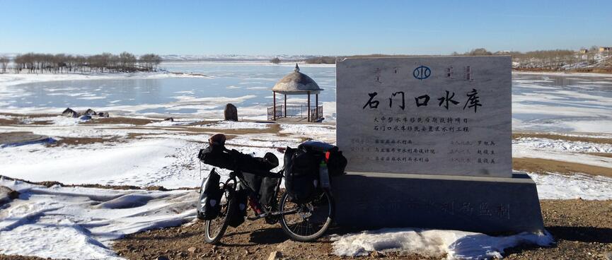 My bike leaning against the lake plaque.