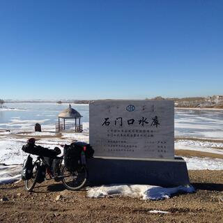 My bike leaning against the lake plaque.