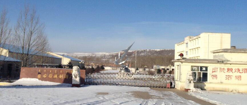 A sculpture of a silver arrow.
