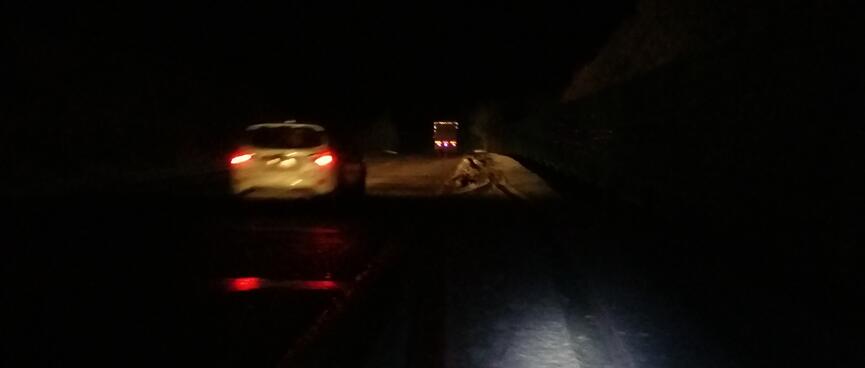 A car passes me.