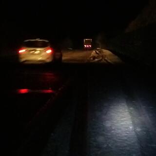 A car passes me.