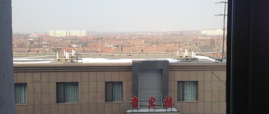 Tiled terracotta roofs extend into the distance.