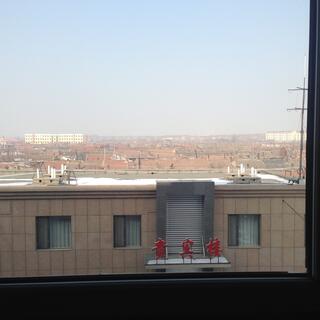 Tiled terracotta roofs extend into the distance.
