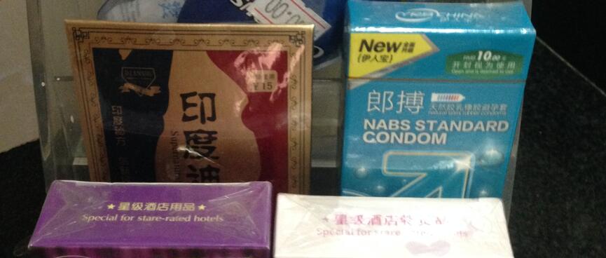 Boxes of condoms and a package of massage oil.