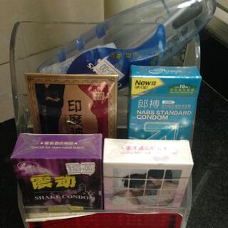 Boxes of condoms and a package of massage oil.