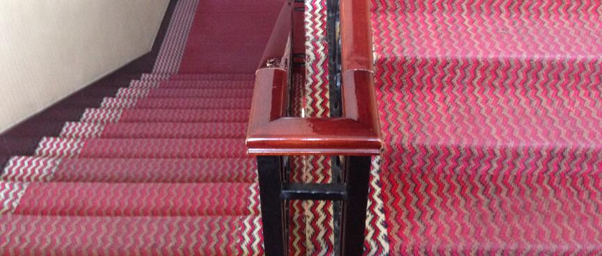Red carpet on the hotel staircase.