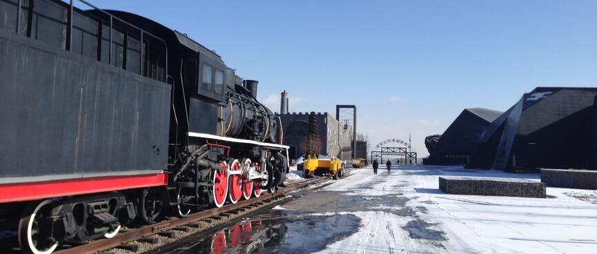 A black locomotive with red wheels.
