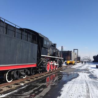 A black locomotive with red wheels.
