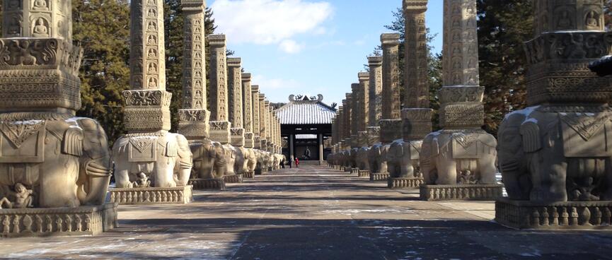 Each pillar is held up by a stone elephant.