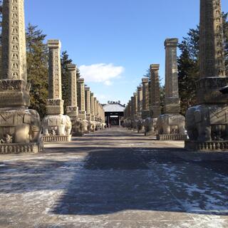 Each pillar is held up by a stone elephant.