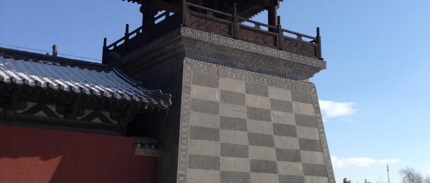 Checkerboard pattern on the base of a watchtower.
