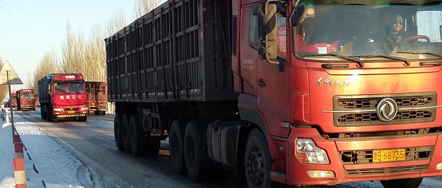 A long line of large red trucks.
