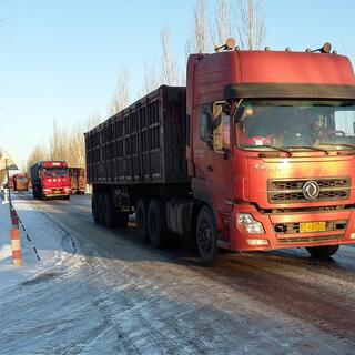 A long line of large red trucks.
