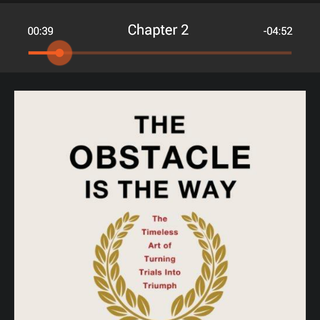 The Audible player showing the cover and play position of The Obstacle Is The Way audio book.