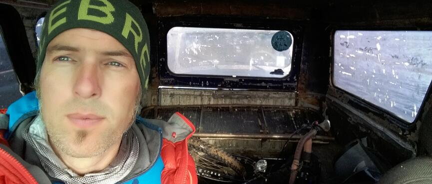 Dressed in warm clothes, I sit in the metal jeep and gaze out the window.