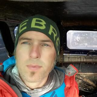 Dressed in warm clothes, I sit in the metal jeep and gaze out the window.