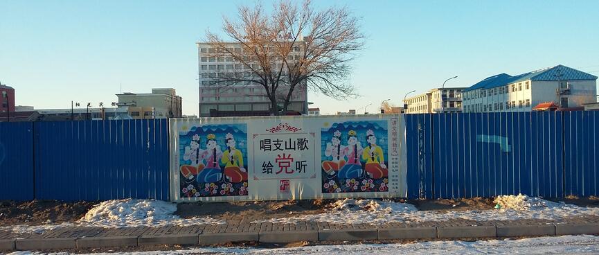 A poster features illustrations of women wearing bright pants and tops, round patterned bras and flowers in their hair.
