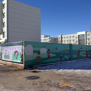 An illustration depicts children in Mongolian cloaks playing outside white gers.